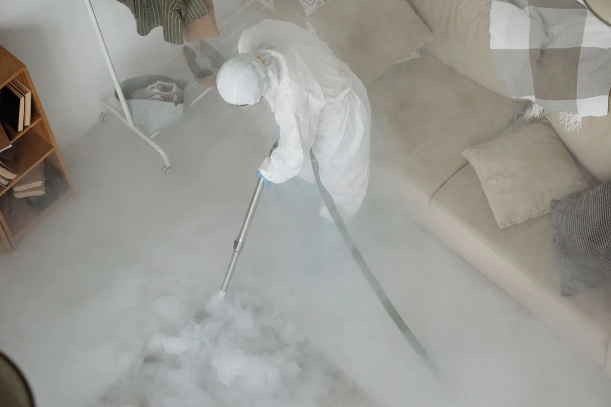 Biohazard cleanup technician in protective equipment, Bridge City, LA